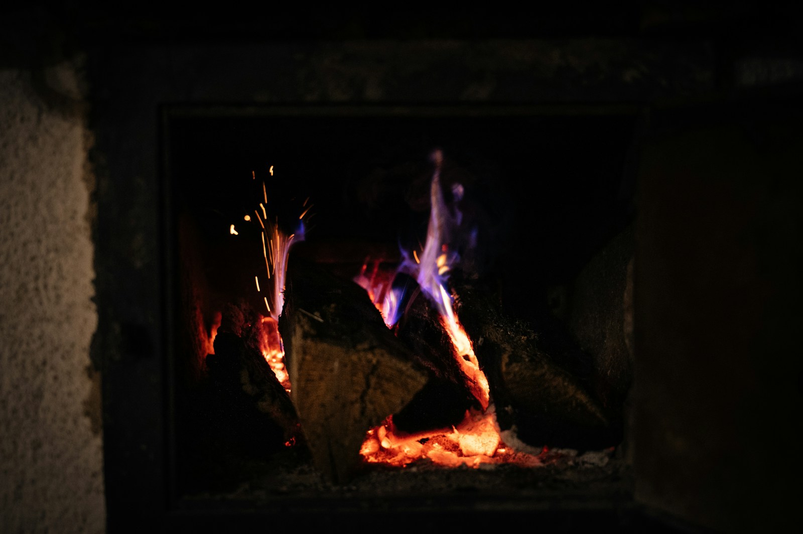 a fire burning in a fireplace with bright flames
